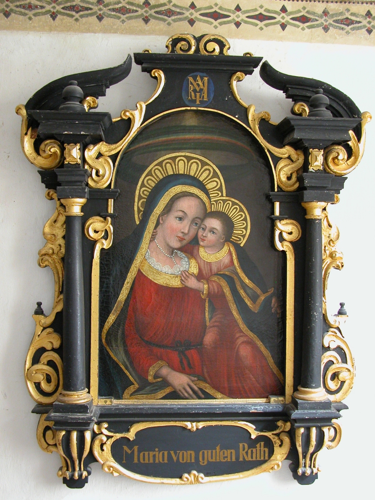 Maria von guten Rat: ein Gemälde einer lieblichen Madonna mit Jesuskind am Schoß. Der prunkvolle Holzrahmen ist in Schwarz und Gold gehalten